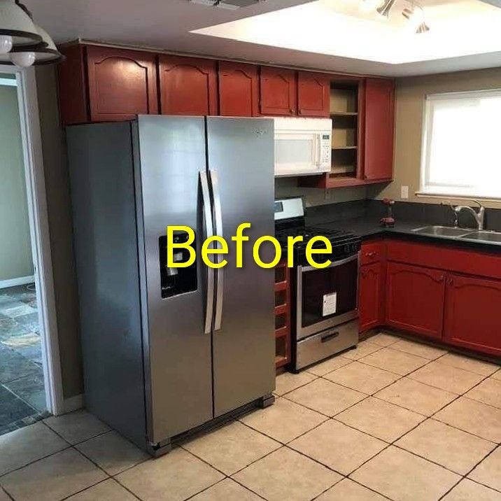 Kitchen before remodel — dated dark cherry cabinets